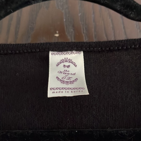 The Wizard of Oz black long sleeved sweater with lace and pearls at the neck. Sm - Picture 3 of 4